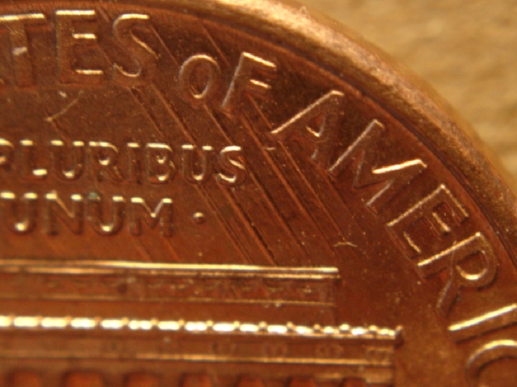 1994-P-LMC:-Die-Scrapes-From-Feeder-Finger-Damage-On-Reverse.